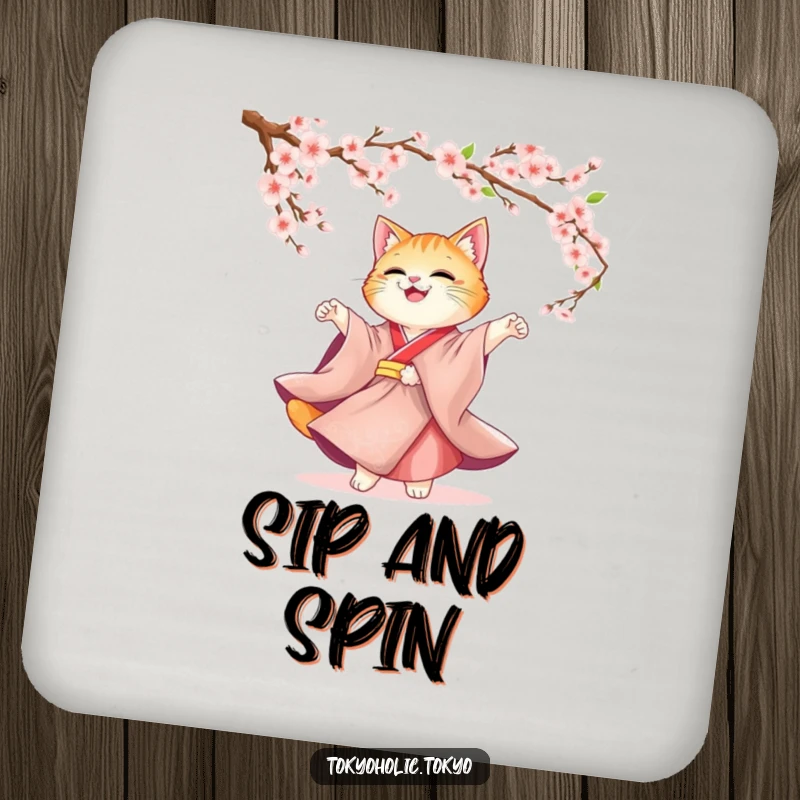 Funny Cat Kimono Coaster: A cute cat in a kimono twirling under cherry blossoms design, perfect for protecting surfaces with elegance.