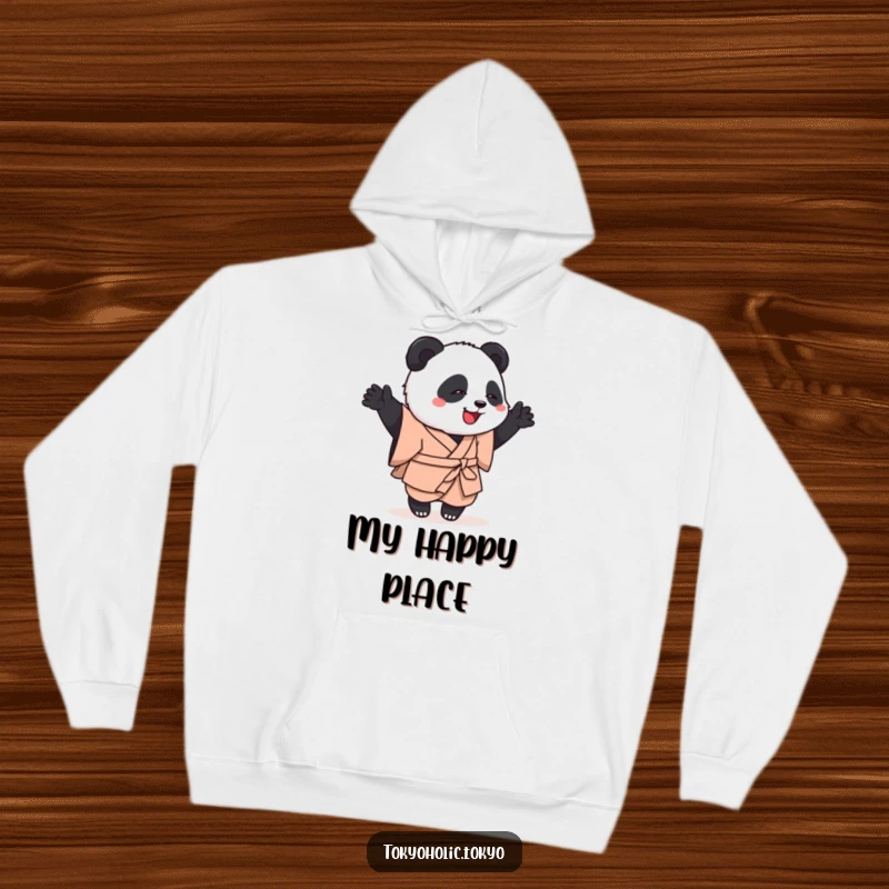 Funny hoodie featuring a playful panda in a simple kimono, cheerfully engaged in a clumsy but happy dance, offering warmth and humor.